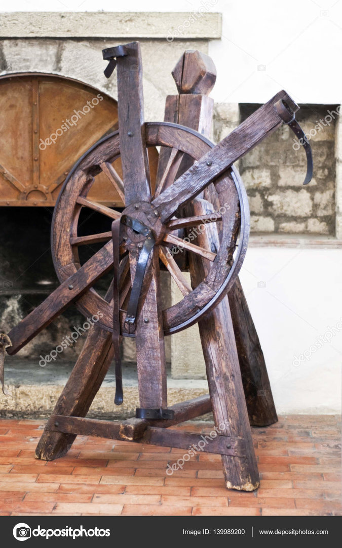 depositphotos_139989200-stock-photo-wheel-of-torture-in-an.jpg