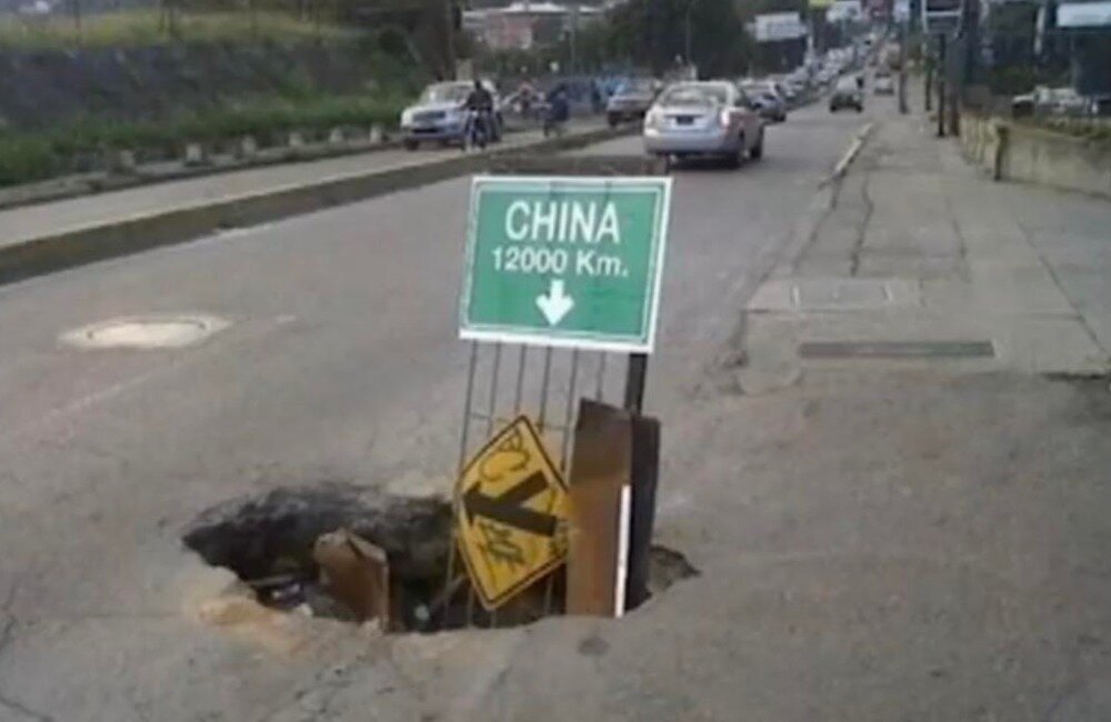Article-Image-HilariousSigns-A-Hole-To-China-Apparently.jpeg.662ec21d1cd91e8442fb382b7ffa417f.jpeg
