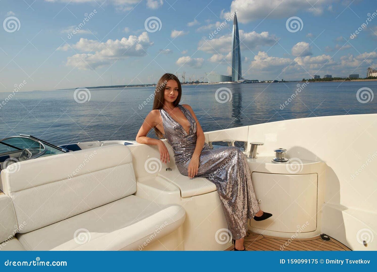 gorgeous-woman-long-straight-brown-hair-silver-shining-dress-sitting-white-sofa-luxury-yacht-sunny-summer-day-159099175-1462502924.thumb.jpg.b5adaca3e1591219117d7dde9f9b0173.jpg